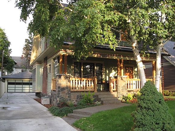 North side with 3 car Garage & Shop