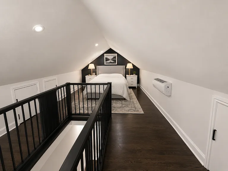 Tucked away on the upper level, this spacious bonus suite (4th bed) features hardwood floors, thoughtfully designed concealed storage, generous wardrobe space, and endless flexibility to fit your lifestyle.