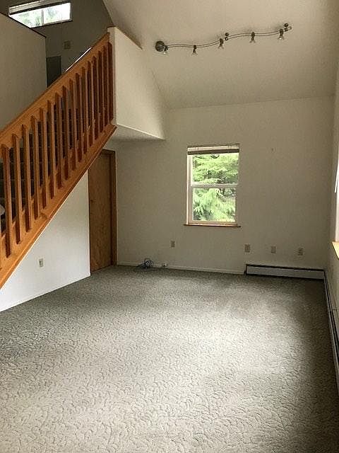 Living room with stairs to loft bedroom