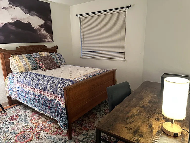 Full size bed with work desk in bedroom. (queen bed available on request)