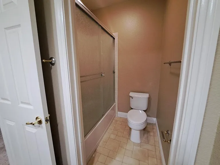 Secondary bath with glass shower doors