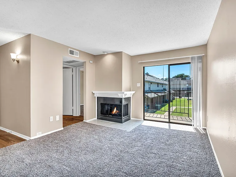 Updated dining area with ceiling fan and direct access to private patio or balcony.