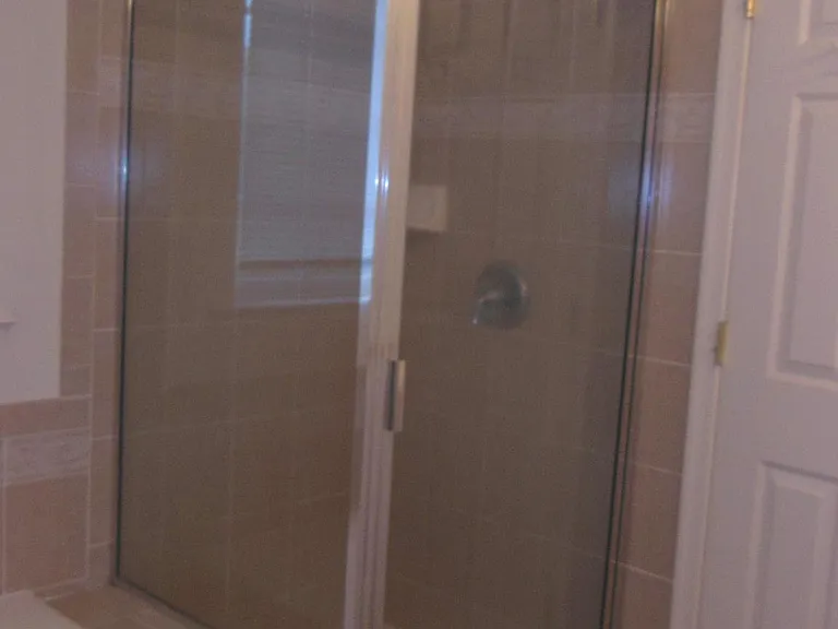 Owner's bathroom with shower stall and garden bath