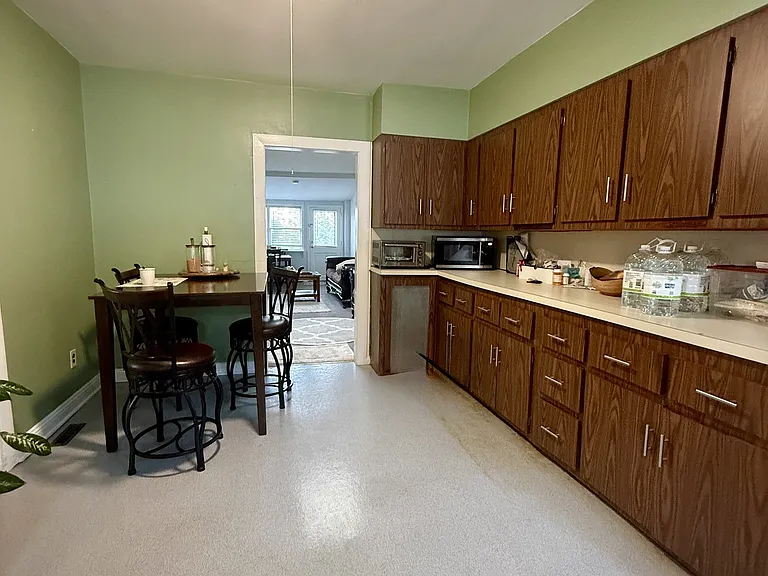 Spacious eat-in kitchen, walls will be painted a neutral shade