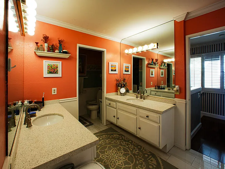 Master bathroom connected to the master bedroom. Two vanities. New tile floors and brand new vanities.