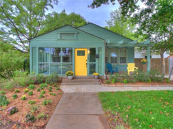Front view, home faces south, landscaping, lots of mature trees
