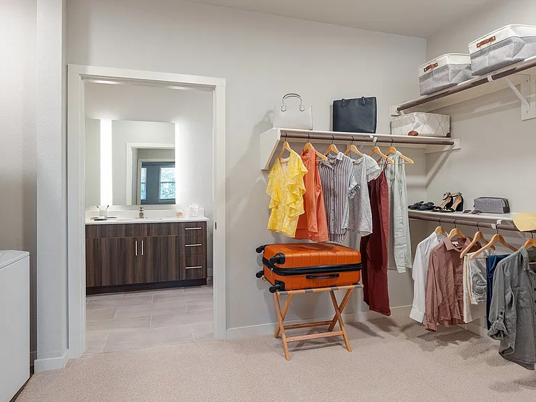 Large walk-in closets with shelving in select bedrooms.
