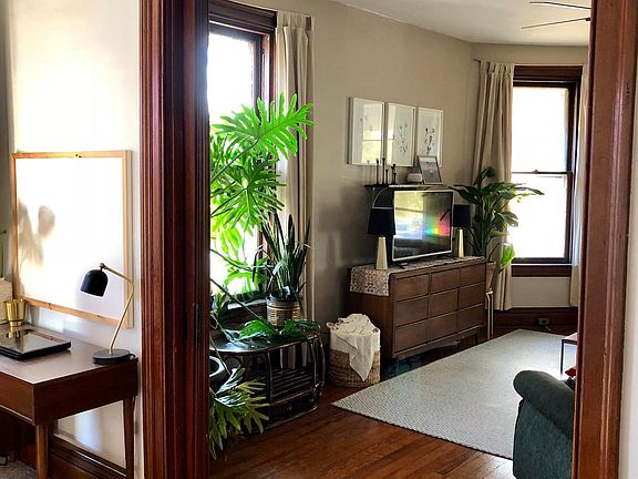Original pocket doors separating living and bedroom