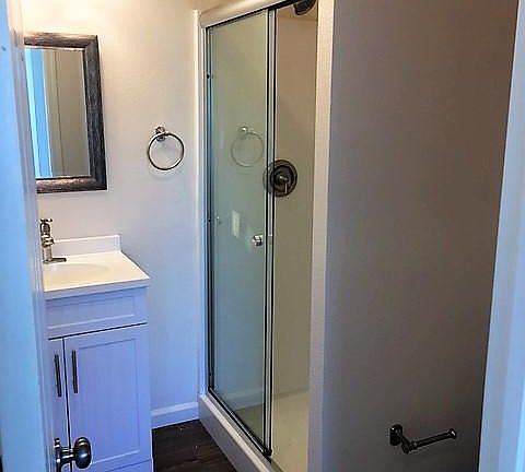 Bathroom with walk in shower.