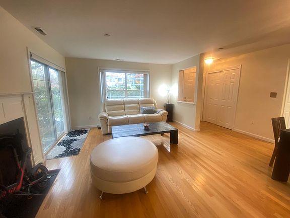 Spacious Living Rm: hardwood floor plus sliding door to patio.