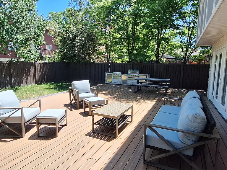 Backyard with large deck and outdoor kitchen (not warranted). Wiring for outdoor TV.