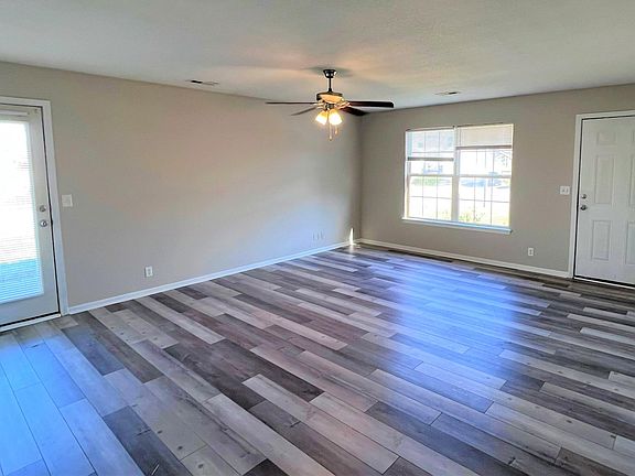 LR FROM KITCHEN...DOOR TO SIDE OPENS UP TO PATIO WITH FENCING CURRENTLY IN PROCESS