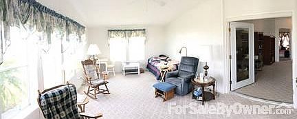 HUGE 4-SEASON SUN-ROOM WITH LAKE VIEWS
						:
						The best room in the house! Bright, large sunroom with french doors & lake views