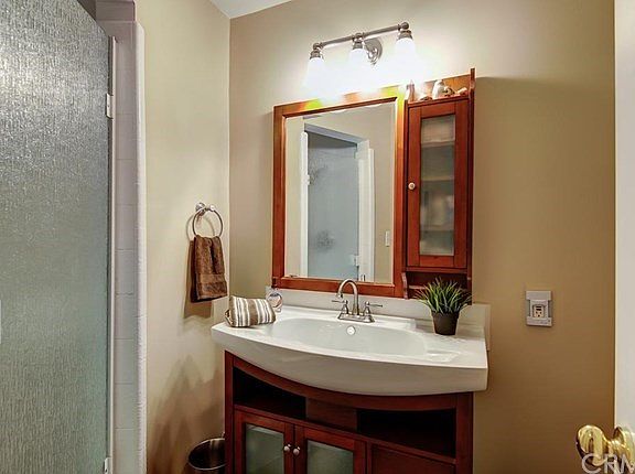 Fully remodeled bathroom with gorgeous vanity and sink.