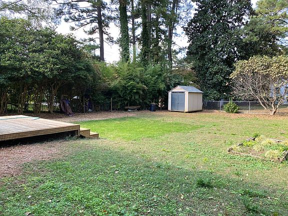 Backyard shed and open grassy area