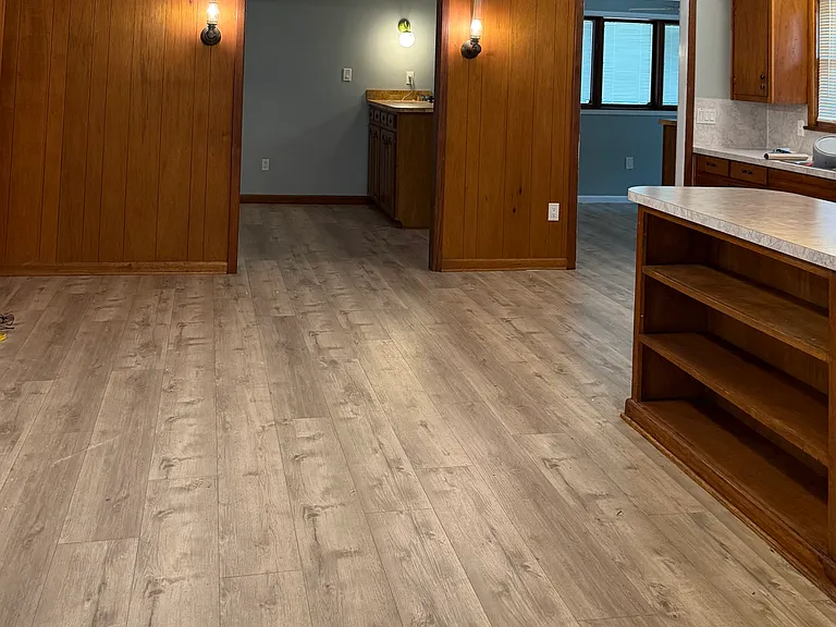 The kitchen dining area and service bar looking into the 3rd living area.