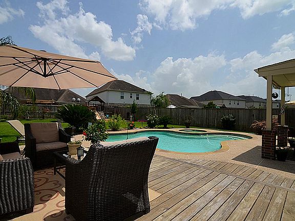 View for the pool and yard from the deck. Great entertainment year round!