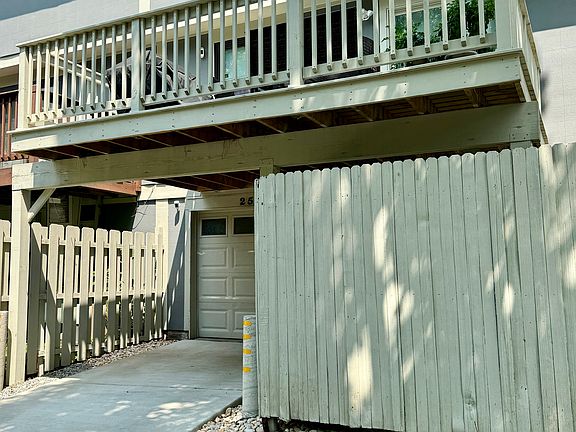 Back of Property.Concrete Driveway, One car garage, Back Deck