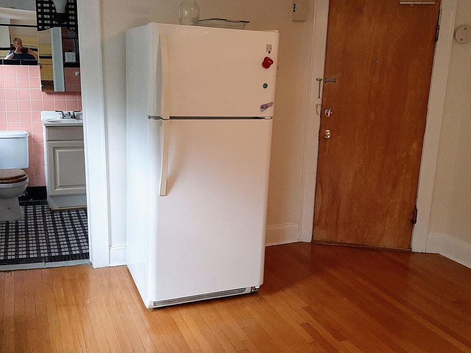 In the kitchen looking towards bathroom and refrigerator