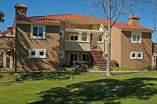 Home is lower right unit, with landscaped fully-enclosed private backyard.