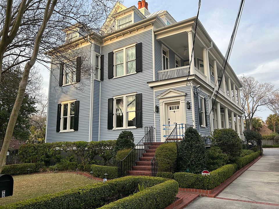 Apt C is on the 2nd floor of the main house. A partial view of the main gardens is seen and the driveway leads to on site parking