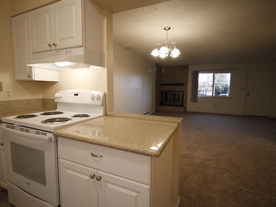 Main floor kitchen with updated cupboards and granite counter