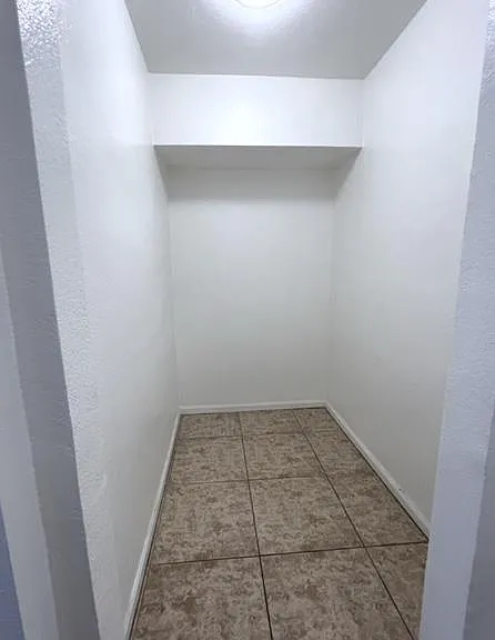 Storage Closet or Pantry located adjacent to laundry and kitchen