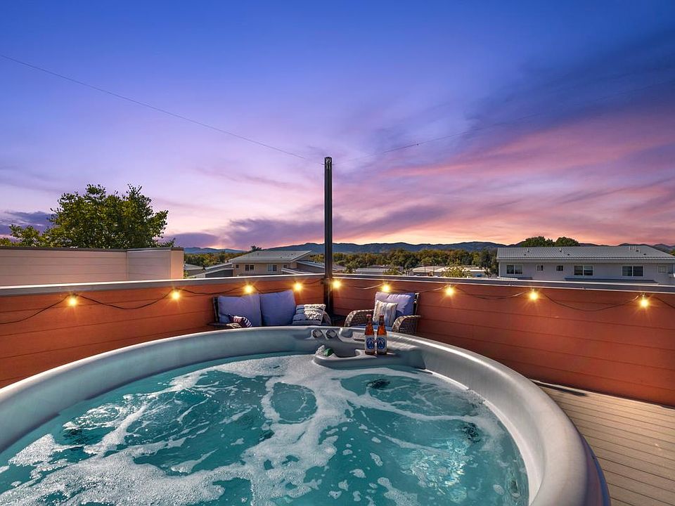 Rooftop hot tub with mountain views.