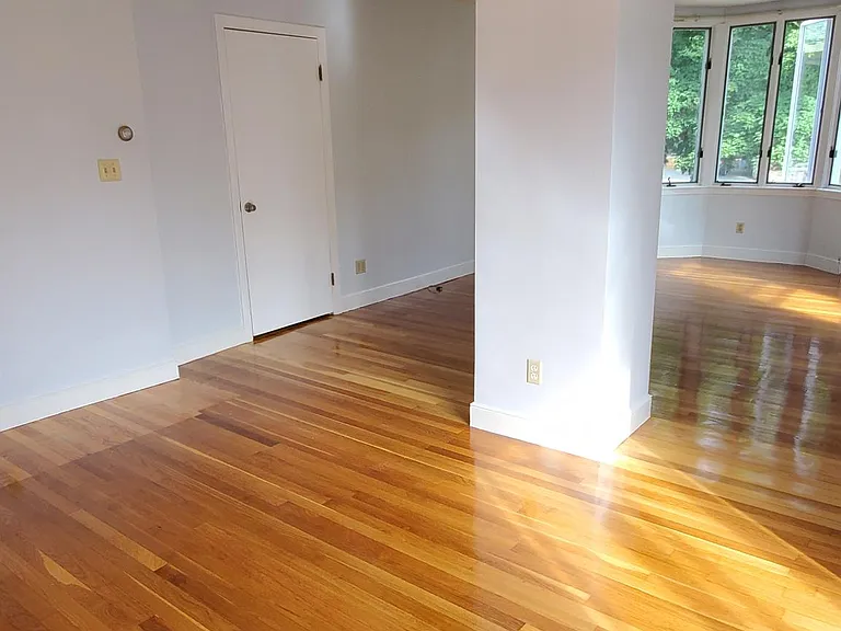 DR space (open LR-DR area) and entrance door from front shared foyer.