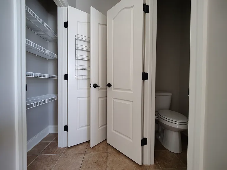 Storage with door from master bathroom.