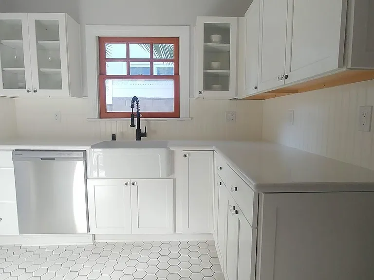 Tastefully updated Kitchen with new dishwasher, sink, counter tops, cabinets and floor.