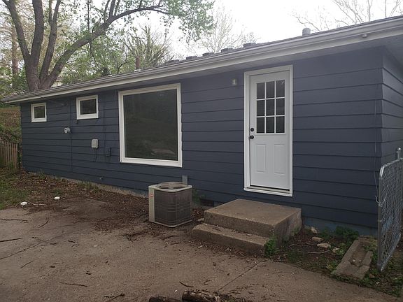 rear patio area with fenced backyard