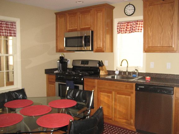 First floor updated kitchen w/stainless steel gas stove, microwave and dishwasher