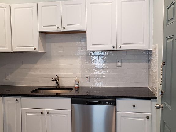 View of kitchen and apartment backdoor