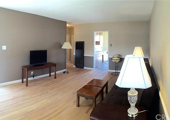 Large living room with gorgeous hardwood floors throughout!