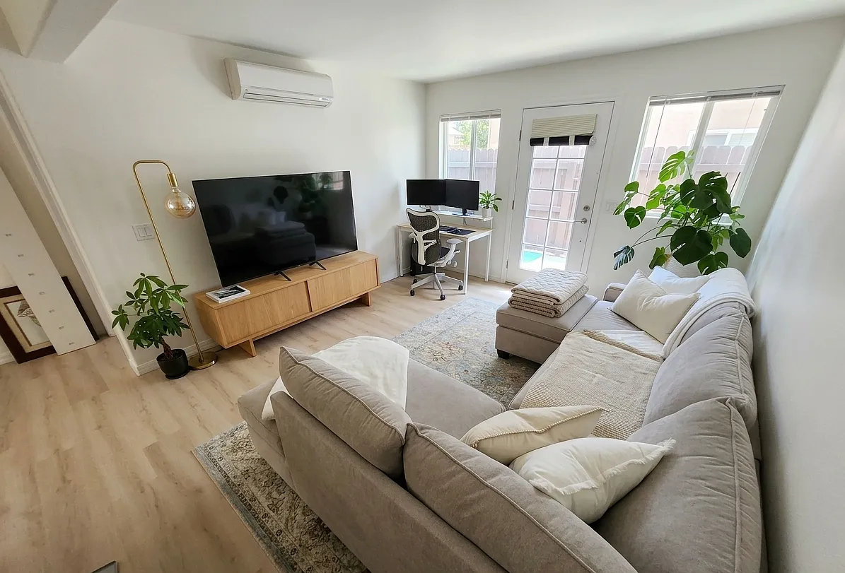Photo 1 of 16 - 5252 Balboa Arms Dr - San Diego, CA Open concept living room with lots of natural light and bright luxury flooring - 5252 Balboa Arms Dr
