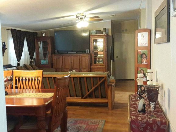 SECOND LIVING ROOM AND DINNING AREA