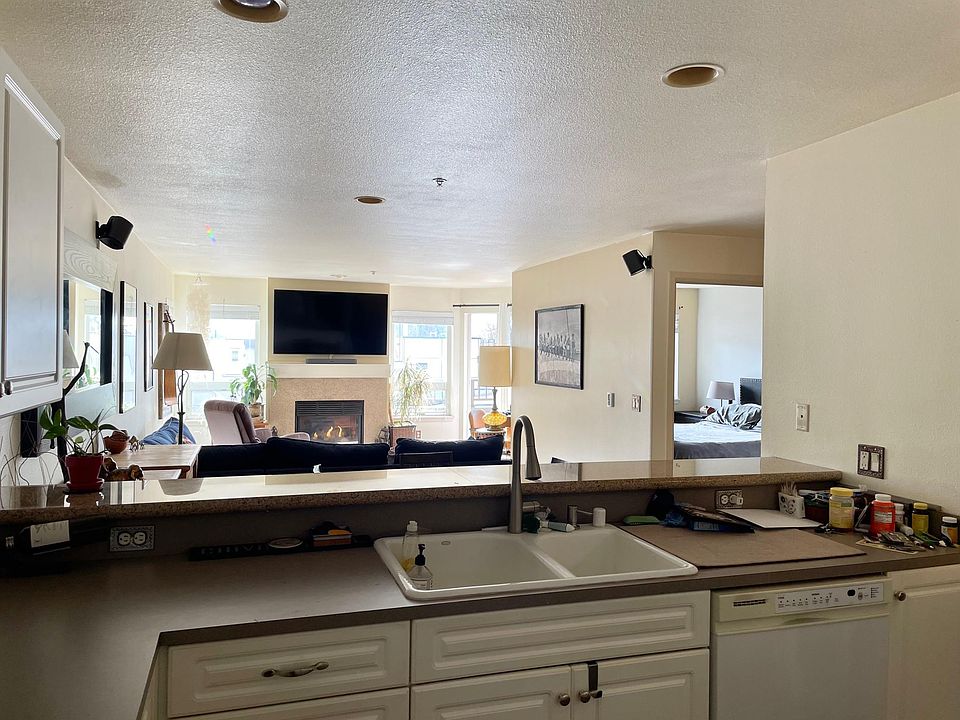 Open floor plan with plenty of light (bedroom visible on the right)