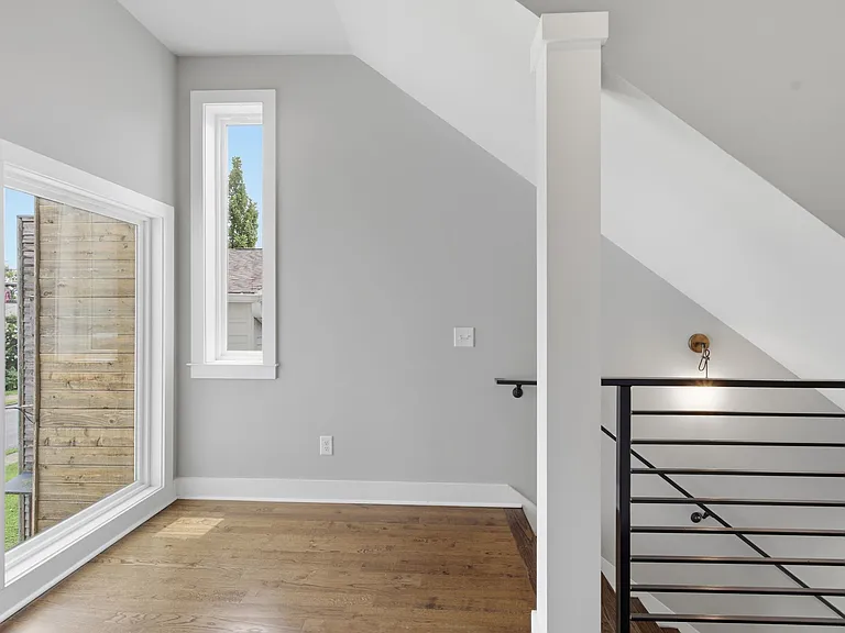 As you walk up the stairs you are greeted by a large window looking over 2nd Ave S