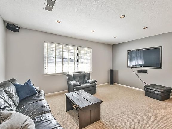 16x11 Media Room - Get comfortable and watch a movie or listen to your favorite music all while enjoying natural lighting with a view of the front yard.