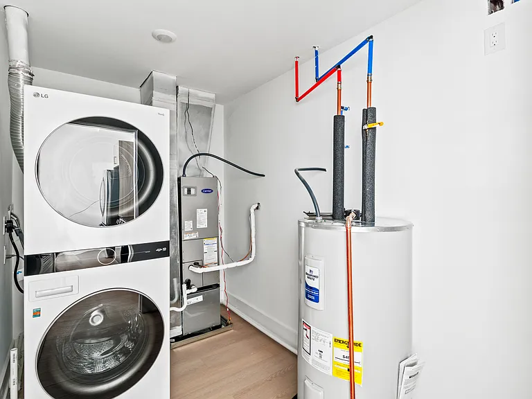 utility room/ washer and dryer
*photo of similar unit, exact finishes and layouts may vary*