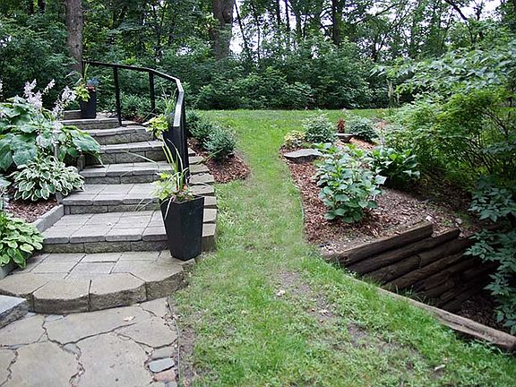 Looking from front door to stairs and driveway. night time solar lighting on stairs.