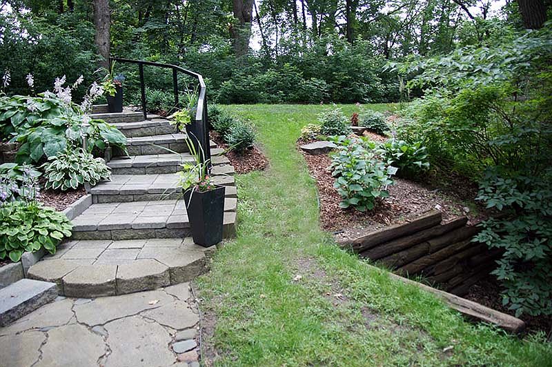 Looking from front door to stairs and driveway. night time solar lighting on stairs.