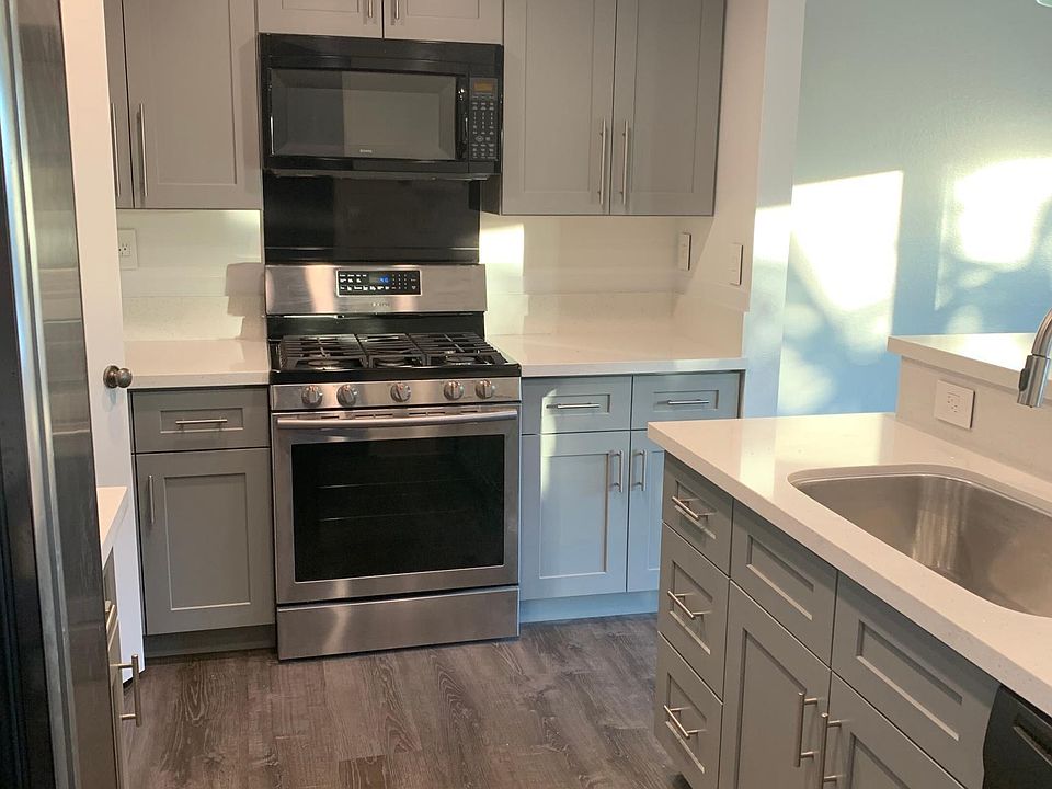 Kitchen with new cabinets, countertop and flooring.