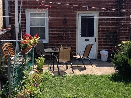 Deck in back yard has space for furniture and full sun