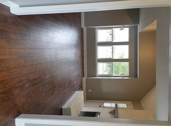 The view from formal dining room through living room. Lots of sunlight and interesting features!