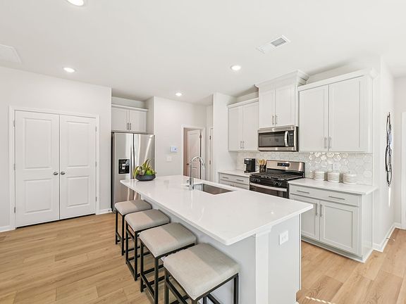 Kitchen in the Jade floorplan at a Meritage Homes community in Mebane, NC.