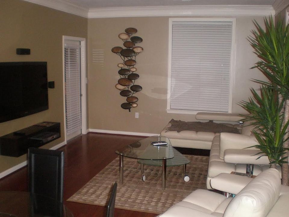 Living Room 4 - Balcony door access (next to hanging art)