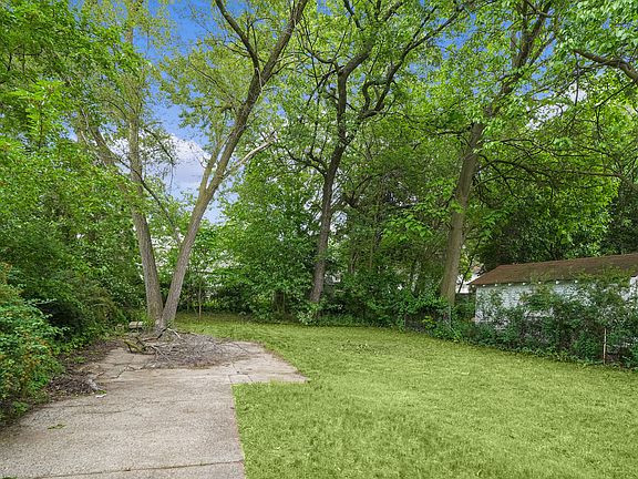 Backyard with private parking pad