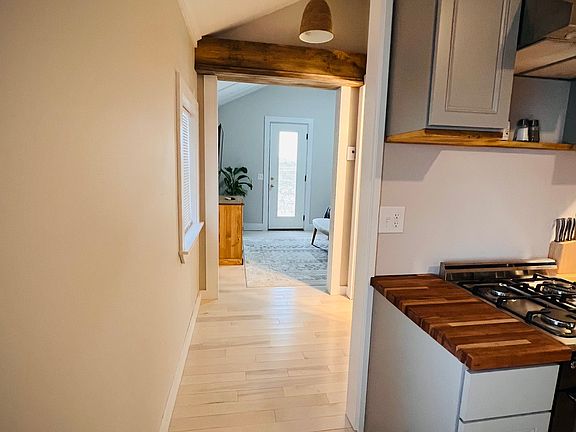 Bedroom is separated from living/kitchen areas by small hallway